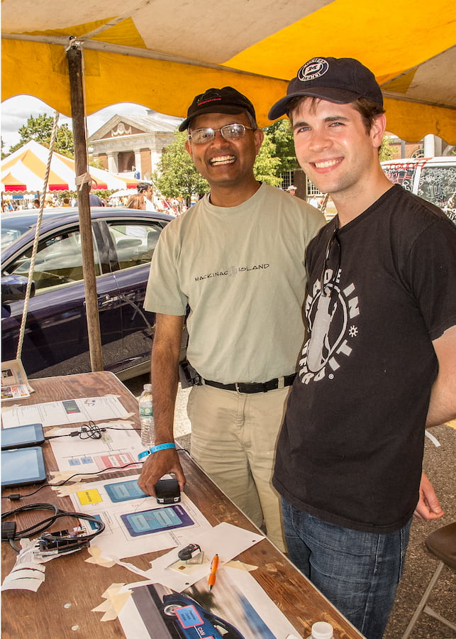 Chris and Prasad at the Dearbor Maker Faire table